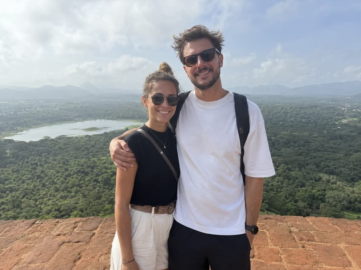 Couple planning a trip together on a shared map